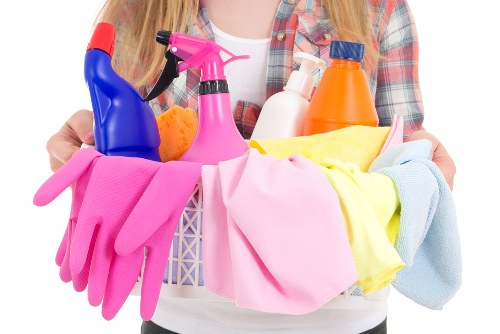 Professional cleaner preparing a Surrey home for a scheduled cleaning visit