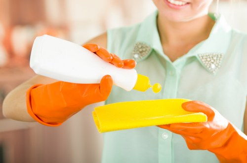 A local cleaning team preparing a Surrey flat for move-out inspection